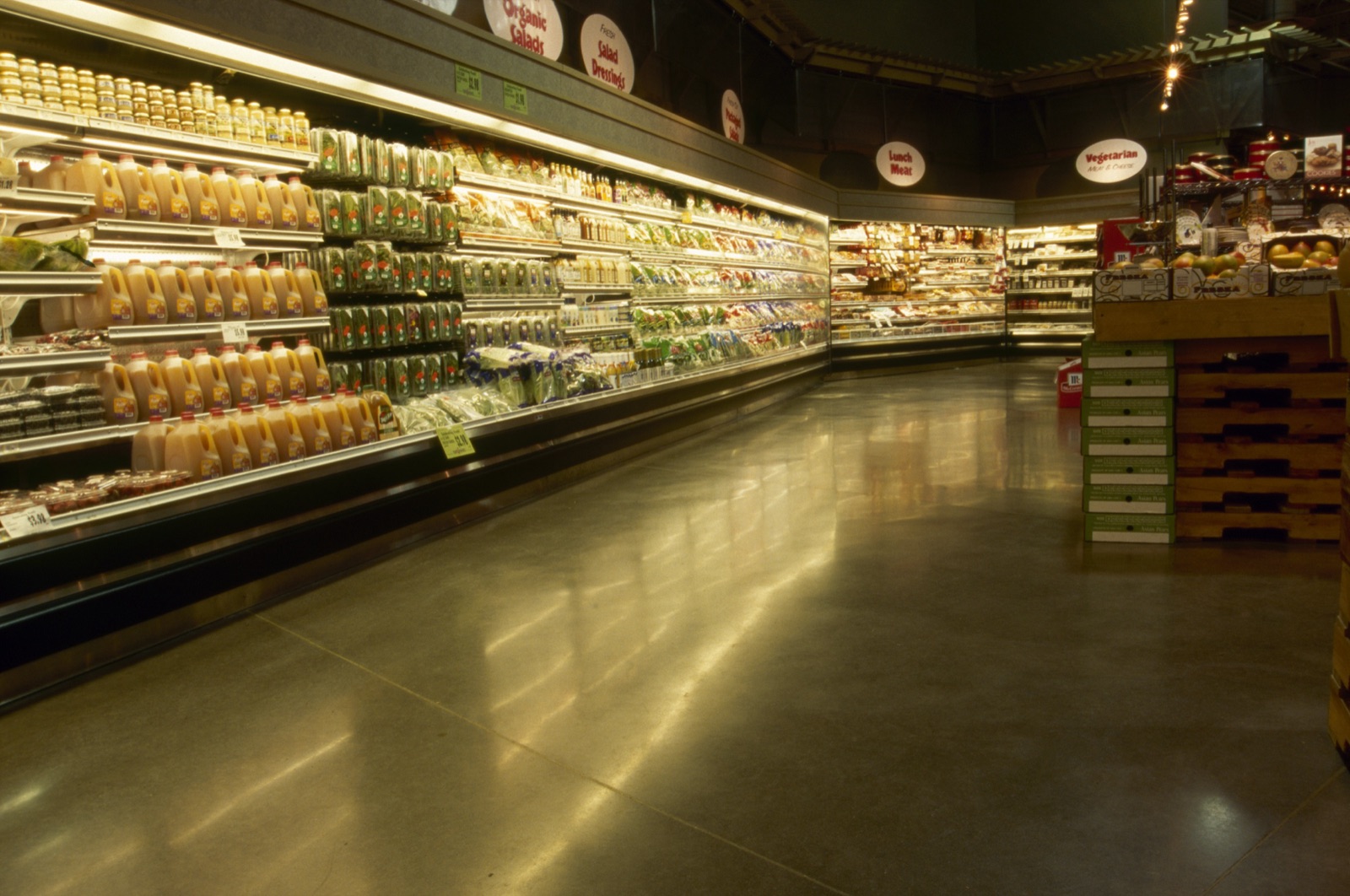 Grocery market refrigerated aisle with polished concrete floor.