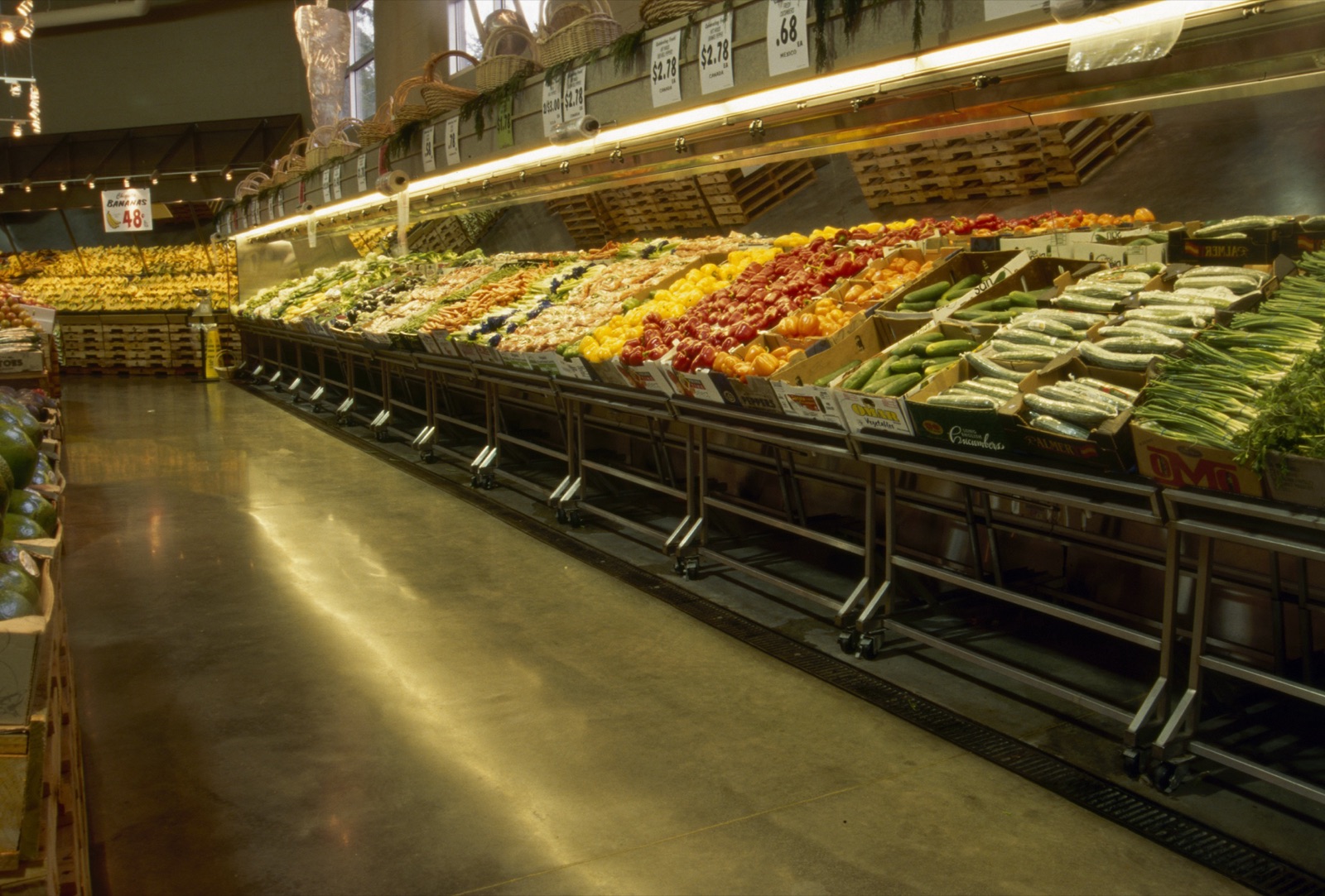 Grocery market produce area with polished concrete floor.