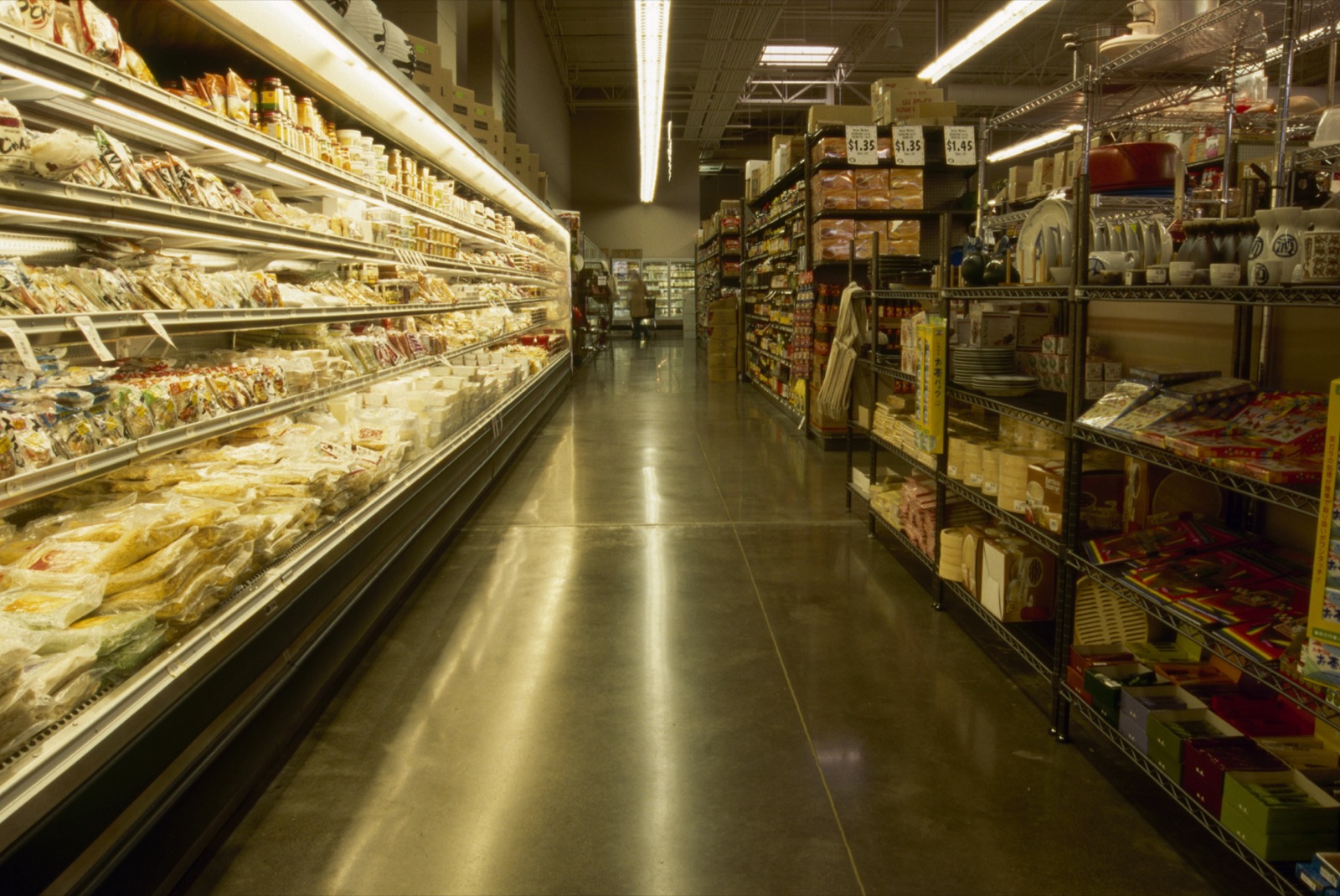 Grocery market aisle with polished concrete floor.