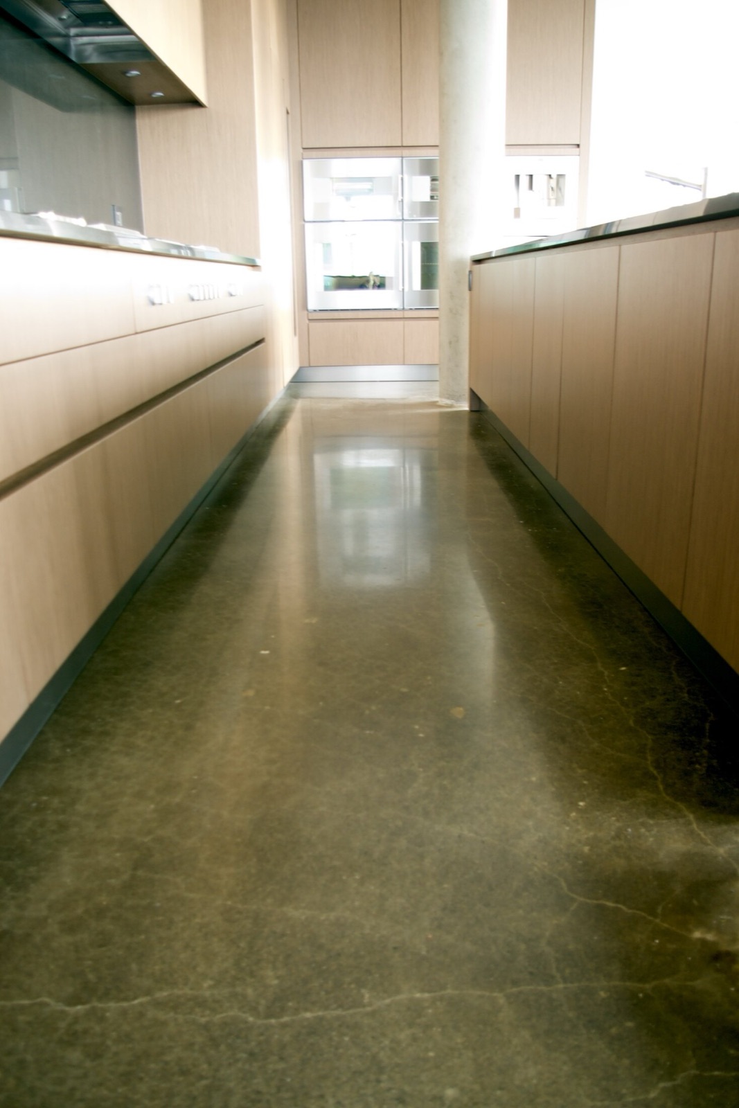 Private residence kitchen with polished concrete floor.