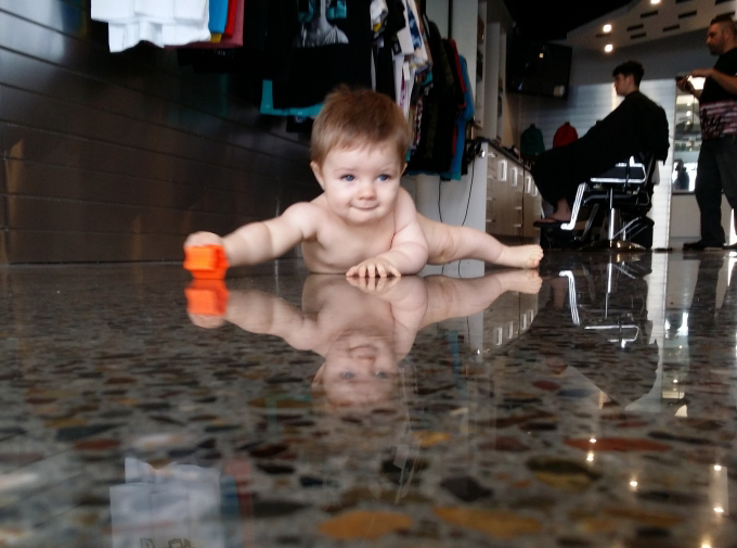baby on polished concrete floor