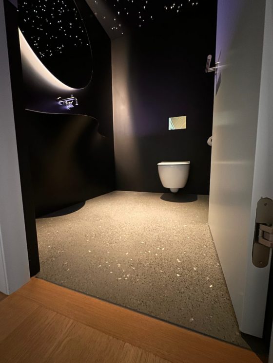 powder room with star lights on ceiling, crazy sink and polished concrete floor