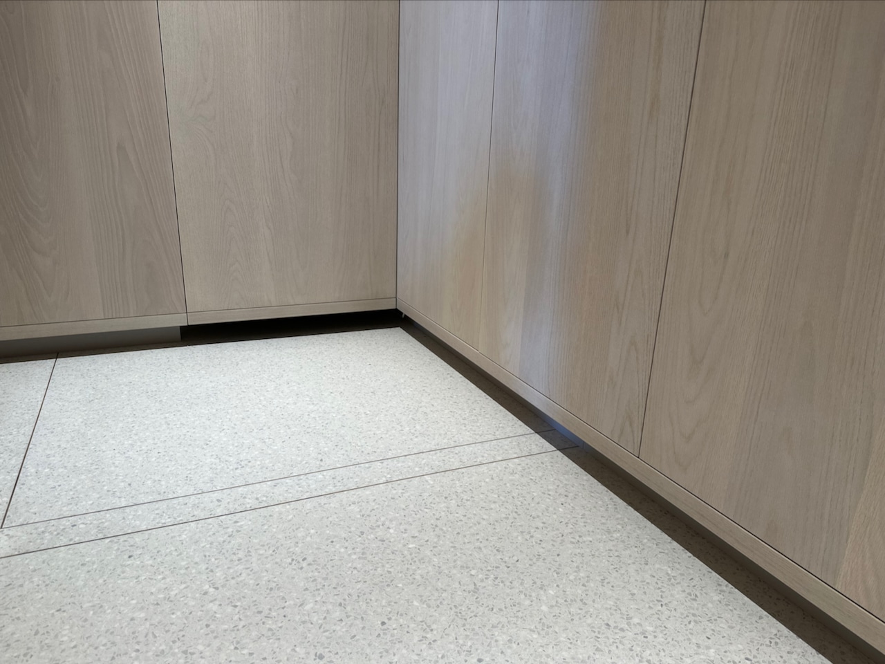white concrete terrazzo with built in cabinets